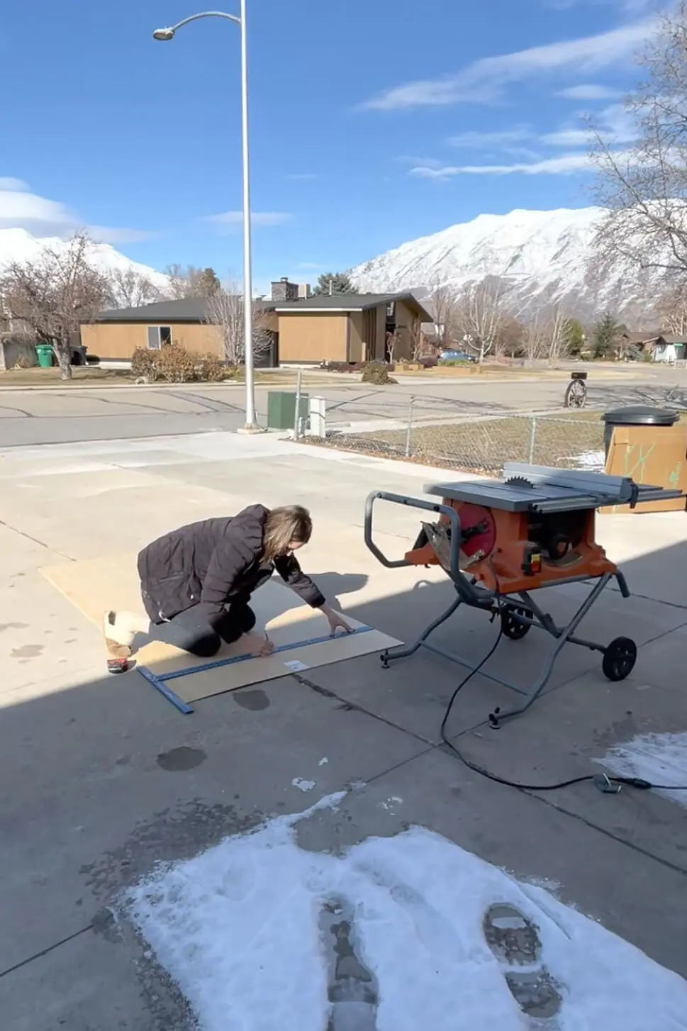 Marking a piece of plywood before cutting.